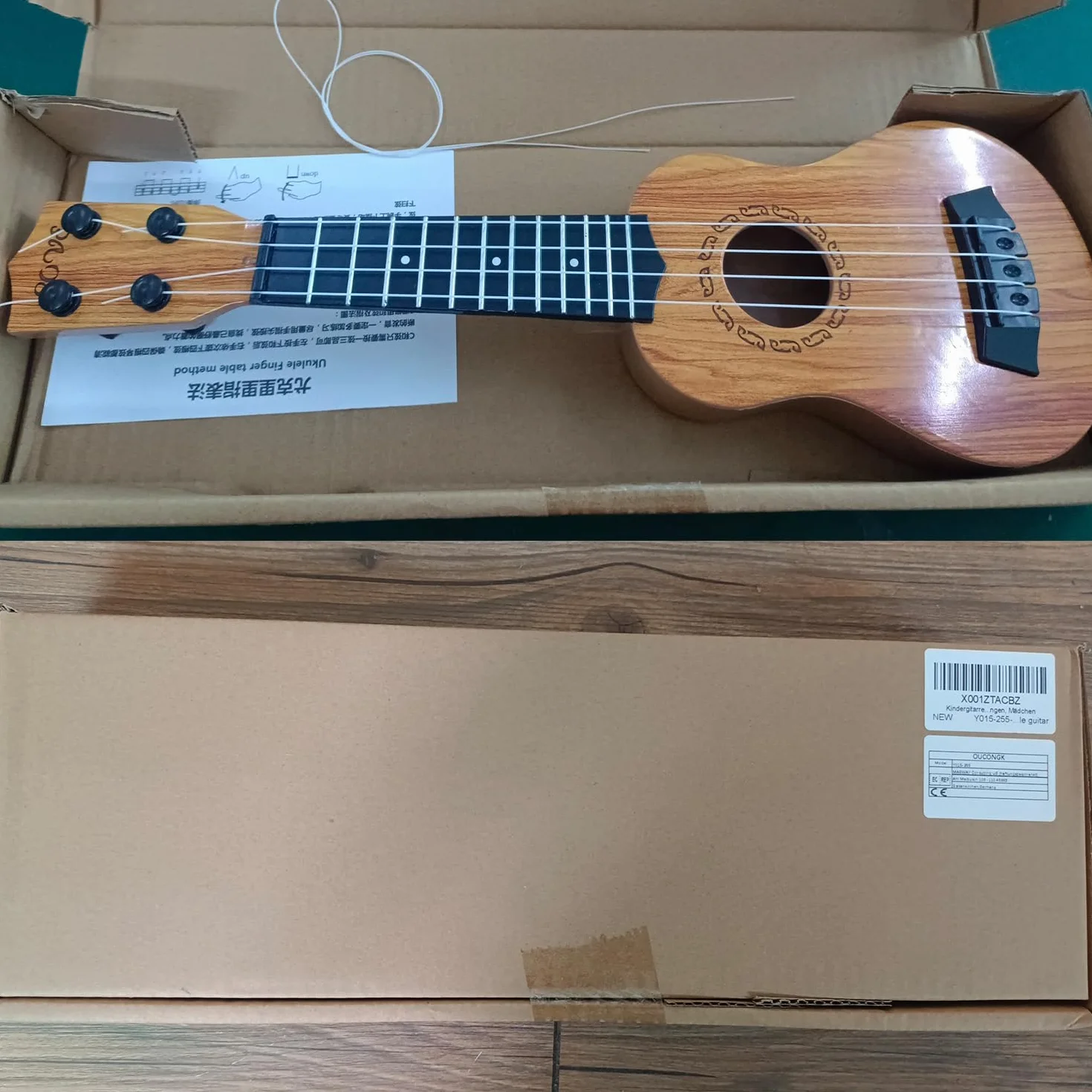 Chitarra per Bambini 38cm Giocattolo 4 Corde Regolabili Mini Ukulele Educativo Regalo