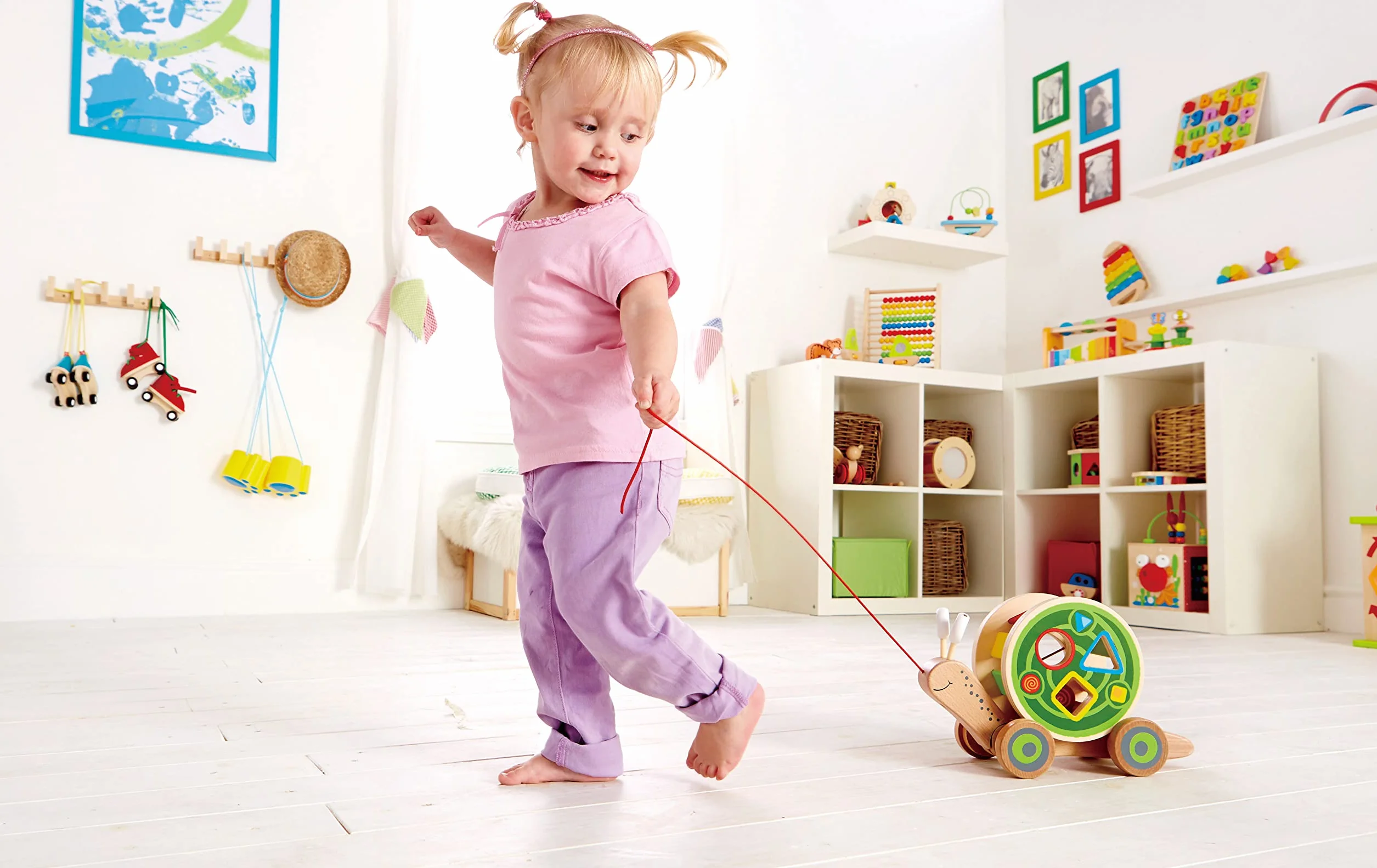Hape Lumaca da trainare | Giocattolo in legno 2 in 1 | Chiocciola trainabile con guscio separabile e forme a incastro
