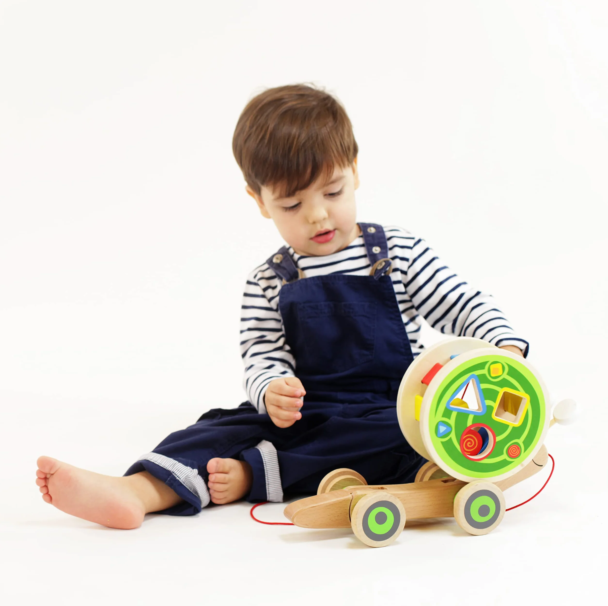 Hape Lumaca da trainare | Giocattolo in legno 2 in 1 | Chiocciola trainabile con guscio separabile e forme a incastro
