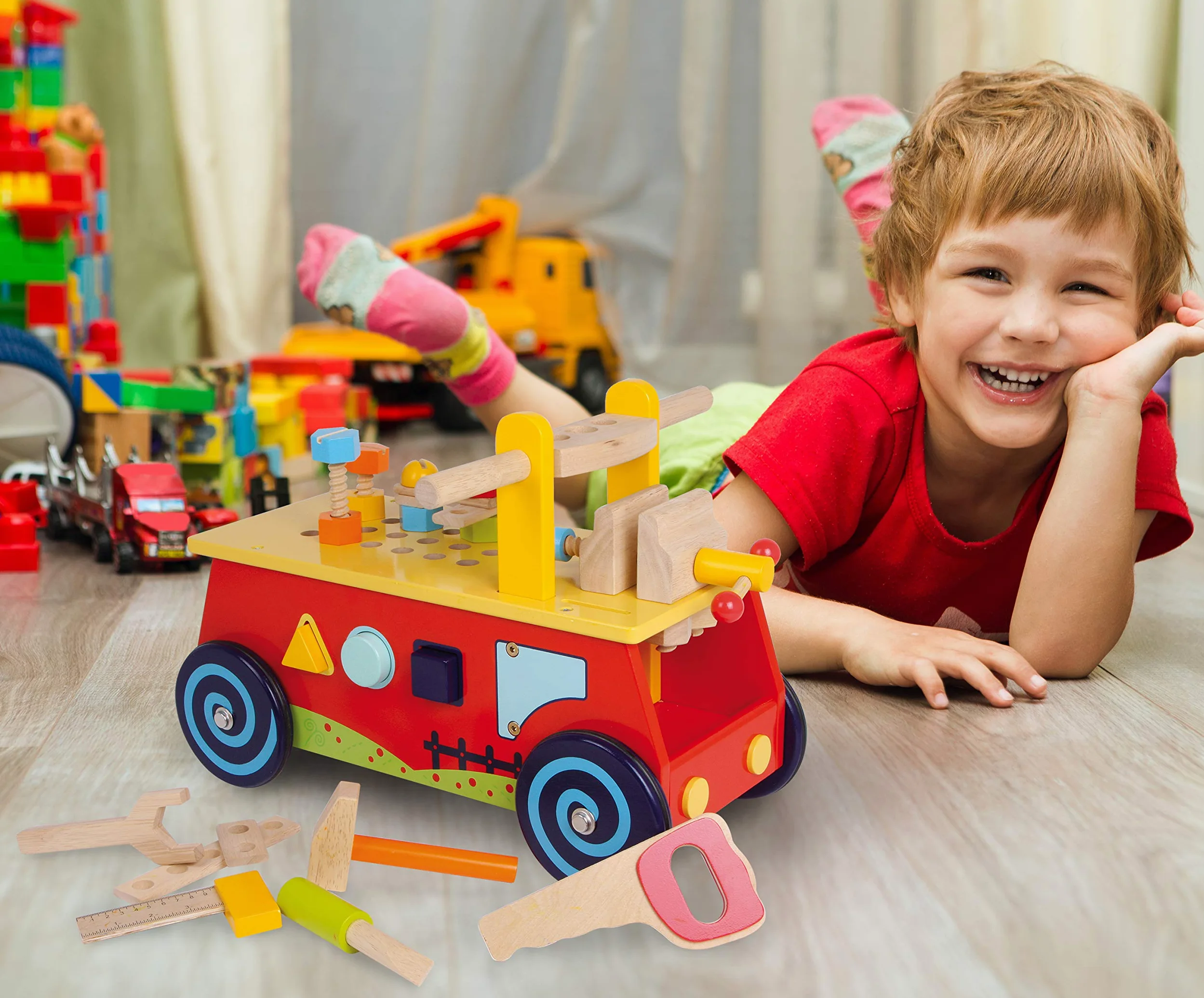 1595 Macchina primi passi «Banco da lavoro» small foot in legno, con tutti i tipi di accessori, divertimento ed apprendimento motorio, a partire da 2 anni.